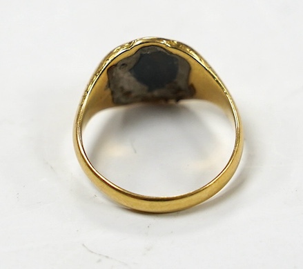 A George V 18ct gold and bloodstone set signet ring, size M, gross weight 4.1 grams. Condition - poor